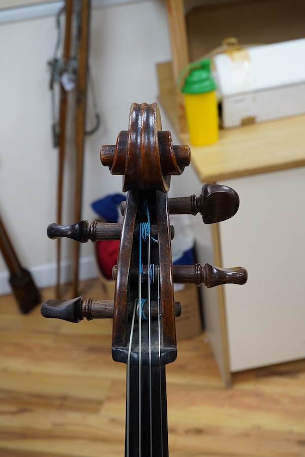 A cased late 19th century German? cello, body length 75cm, together with two bows. Condition - fair to good.